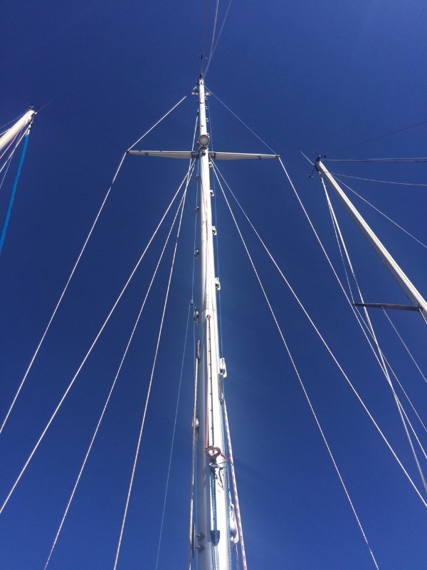 Shiny mast with all the new bits, set against an unusually--even for Greeks--blue winter sky.